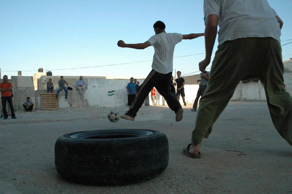 Palestinians Playing Football Jpg.webp.pagespeed.ce .NlBcrPTsjL